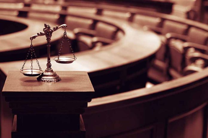 465586604 featured image Scales of justice in an empty courtroom.
