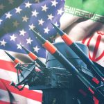 Missiles in front of American and Iranian flags.