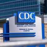 CDC building entrance sign with blue lettering
