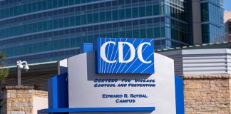 CDC building entrance sign with blue lettering