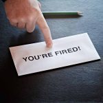 Envelope with YOU'RE FIRED! and pointing finger.