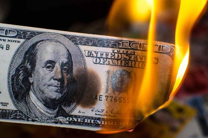 785880961 featured image Burning hundred dollar bill with visible flames