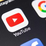 YouTube and Google app icons on a smartphone screen