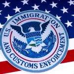 US Immigration and Customs Enforcement badge on flag