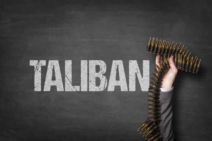 1327780076 featured image Word Taliban with hand holding ammunition belt