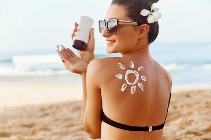 1368652109 featured image Woman applying sunscreen at the beach