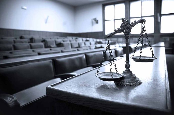 170949320 featured image Scales of justice in an empty courtroom.