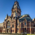 Large ornate brick building with a tall tower
