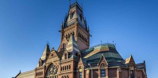 Large ornate brick building with a tall tower