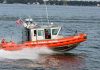 U S Coast Guard boat speeding on water