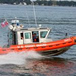 U S Coast Guard boat speeding on water