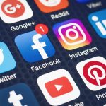 Social media app icons displayed on a smartphone screen