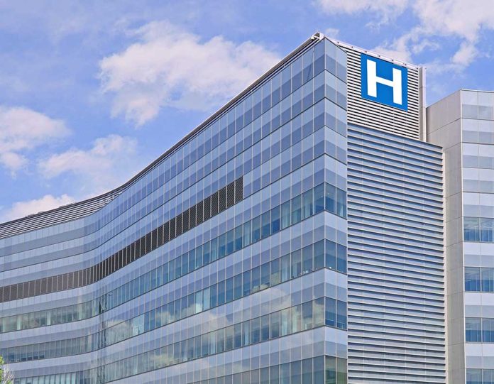 690690040 featured image Modern glass hospital building under blue sky