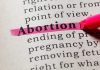 Abortion highlighted in a dictionary with a pink marke