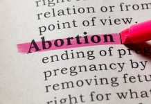 Abortion highlighted in a dictionary with a pink marke