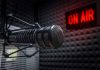 Microphone in soundproof studio with On Air sign