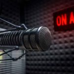 Microphone in soundproof studio with On Air sign