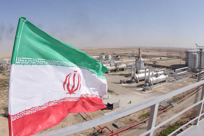 1227310843 featured image Iranian flag near an industrial gas refinery