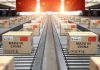 Boxes labeled Made in China on conveyor belt