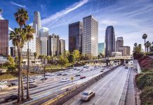 Downtown cityscape with skyscrapers and highway traffic