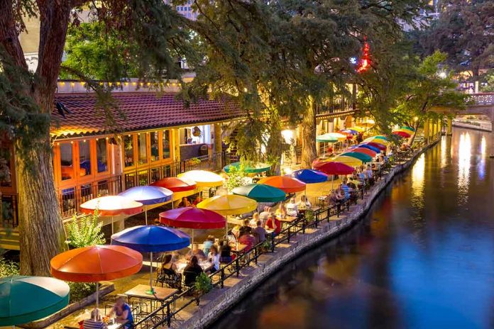232093318 featured image Outdoor riverside restaurant with colorful umbrellas and evening lights
