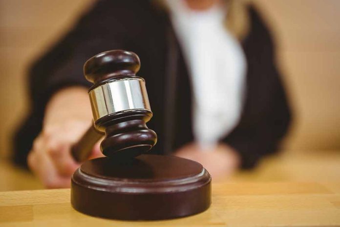 Judge using a gavel in courtroom