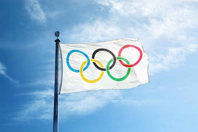 328195181 featured image Olympic flag waving against a clear blue sky
