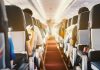 Passengers seated inside an airplane cabin