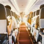 Passengers seated inside an airplane cabin