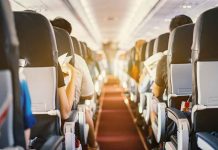 Passengers seated inside an airplane cabin