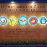 US Department of Defense Security Cooperation display with logos