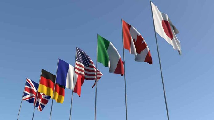 1437085796 Flags of seven countries against clear blue sky
