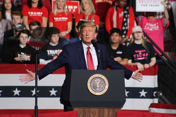 1662925921 Person speaking at podium with crowd behind them