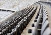 Empty rows of gray seats in a stadium