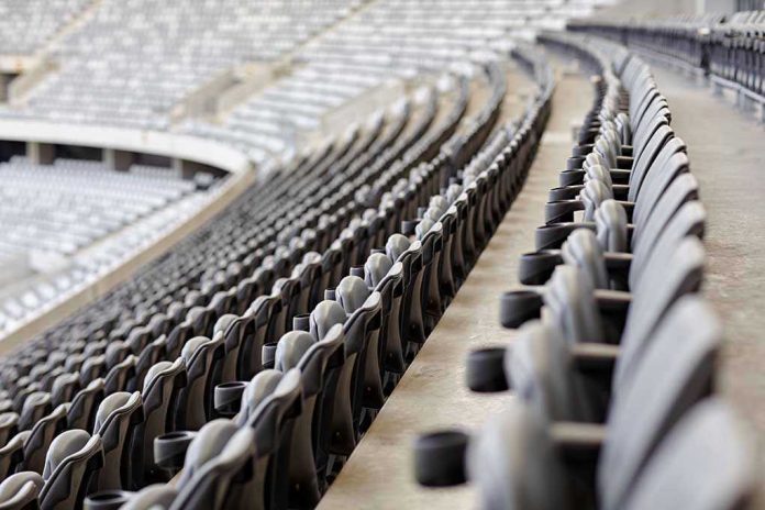 254951527 Empty rows of gray seats in a stadium