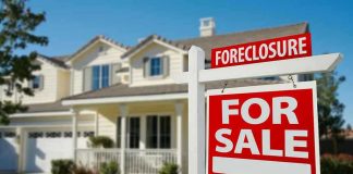 House for sale with foreclosure sign