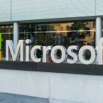 Microsoft logo displayed outside a modern office building