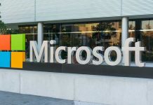 Microsoft logo displayed outside a modern office building