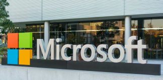 Microsoft logo displayed outside a modern office building
