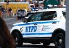 NYPD police car on a city street scene