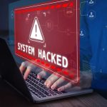 Warning sign System Hacked on laptop screen