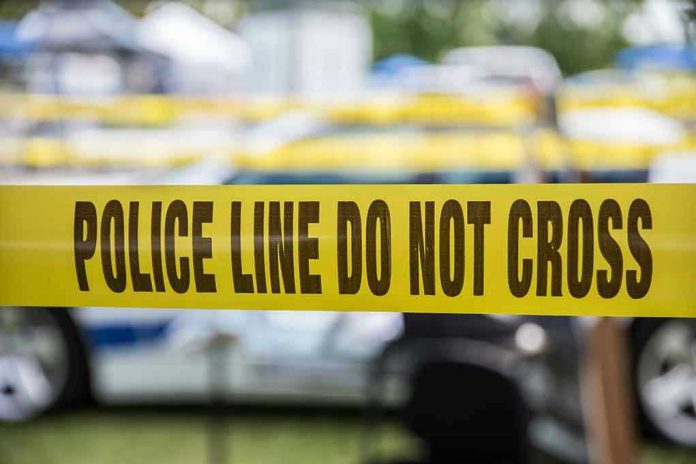 627591236 Yellow police line tape with Do Not Cross.
