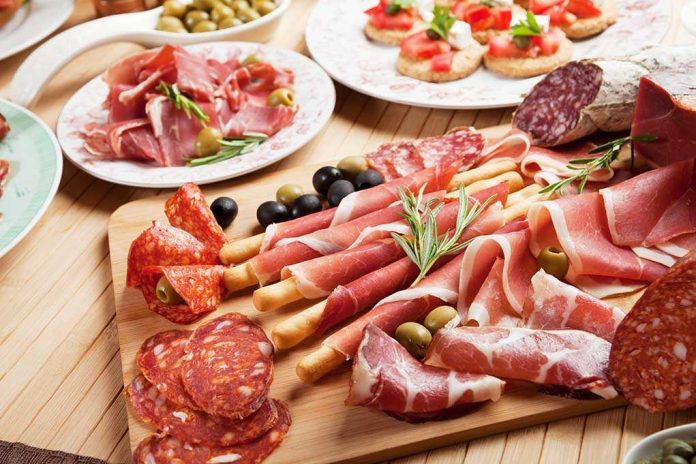 shutterstock_142742008.jpg A beautifully arranged charcuterie board featuring various cured meats and olives