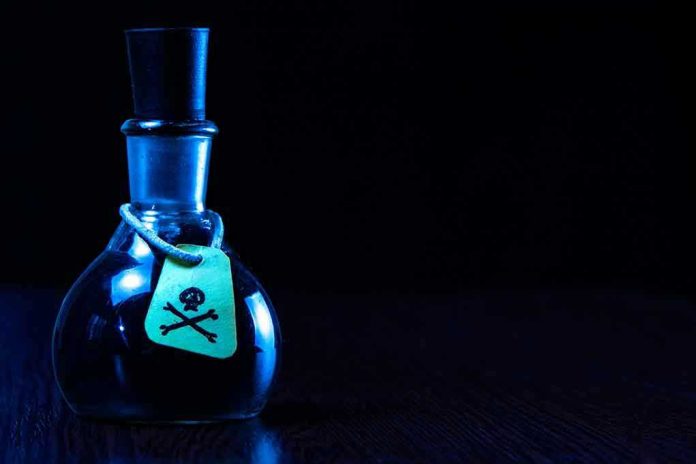 Dark bottle with skull and crossbones label on table