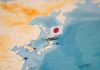 Map of Japan with flag pin placed nearby