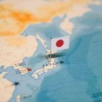 Map of Japan with flag pin placed nearby