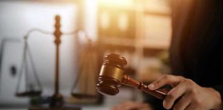 Gavel being struck near scales of justice