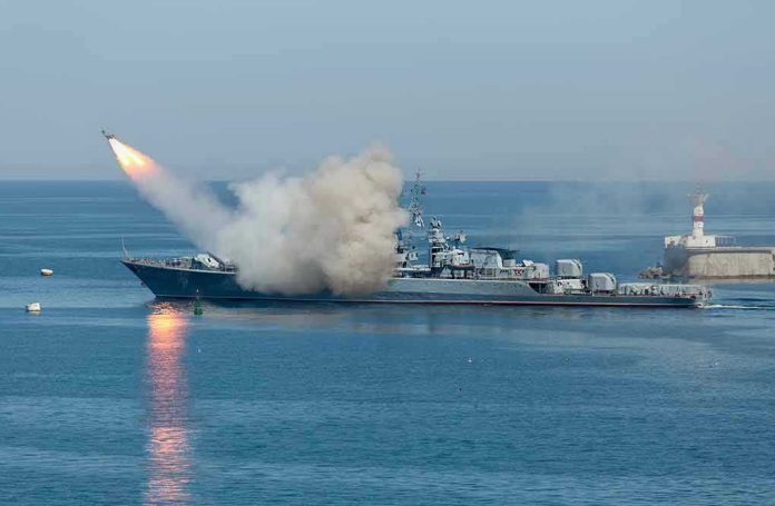 533229181 Warship firing missile in the sea