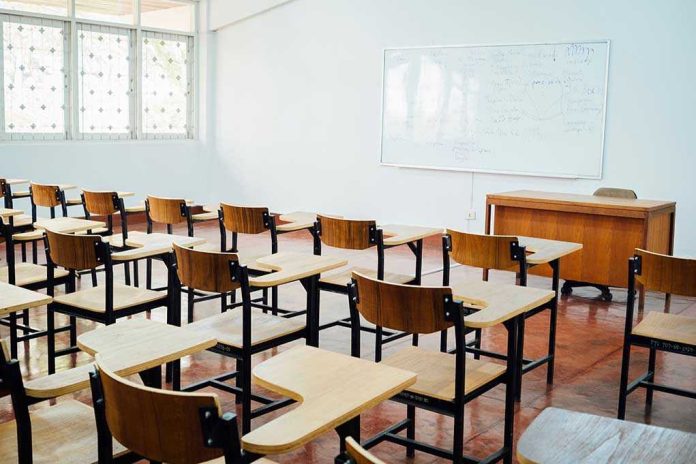 612777398 Empty classroom with desks chairs and whiteboard
