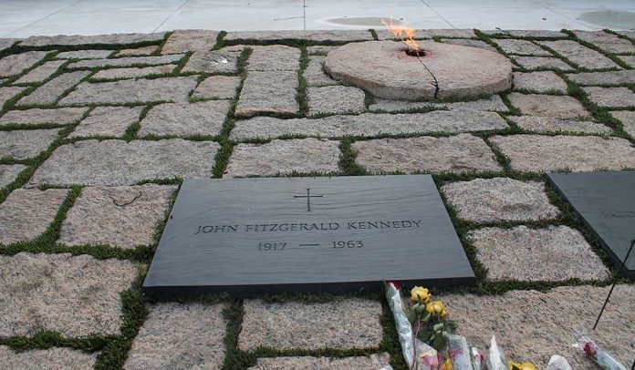 shutterstock_90209500.jpg Memorial site for John F Kennedy featuring a grave marker and an eternal flame